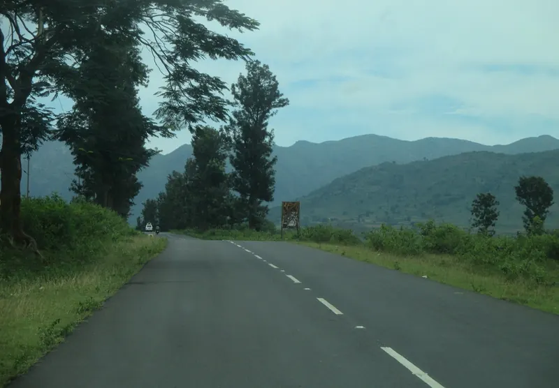 A quiet road through green hills in Araku Valley